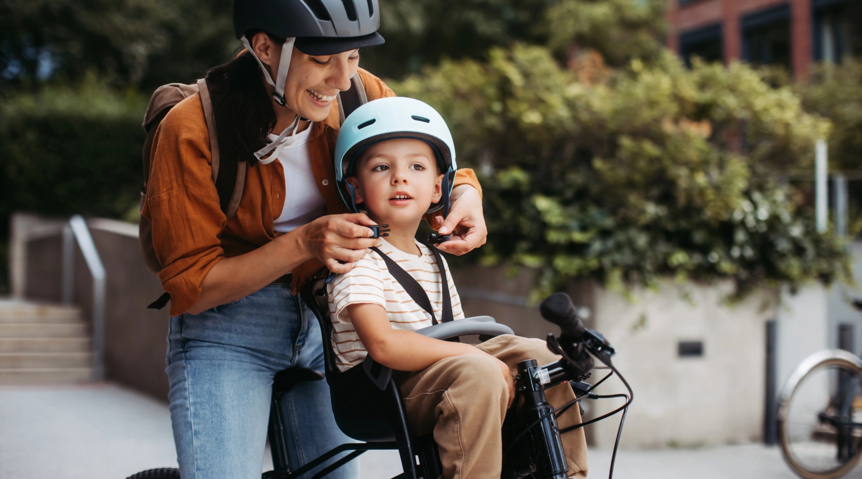 mother-fastening-sons-bike-helmet.jpg